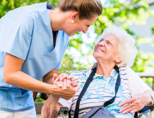 Caregiver with elder patient. Caregiver with elder patient.